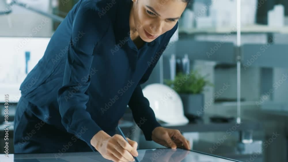 Poster talented young female architectural designer draws building concept on a graphics tablet display ver