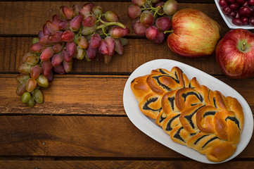 Still life of homemade pastries, sweet poppy pie on the background of fresh fruits, apples and...