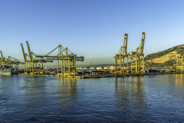 Fototapeta na wymiar Cranes in the dockland in the city of Barcelona, Spain