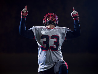 american football player celebrating after scoring a touchdown