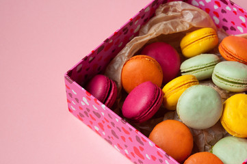 French macaroons in a box with hearts