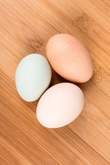 Farm fresh eggs on a wood background
