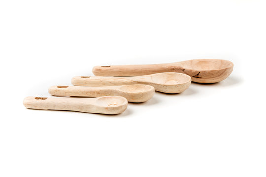 Bamboo measuring spoons on a white background
