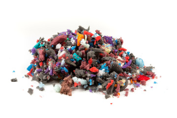 Pile of multicolored foam pieces on a white background