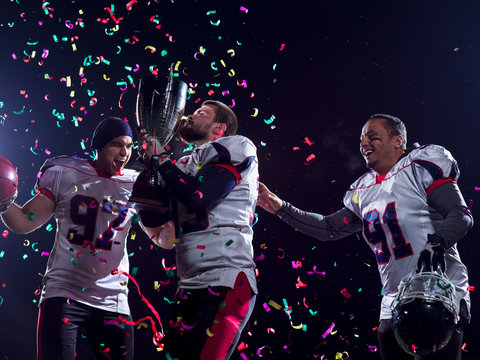 american football team celebrating victory