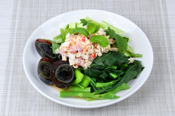 Spicy cucumber salad with dried shrimp and  preserved egg.