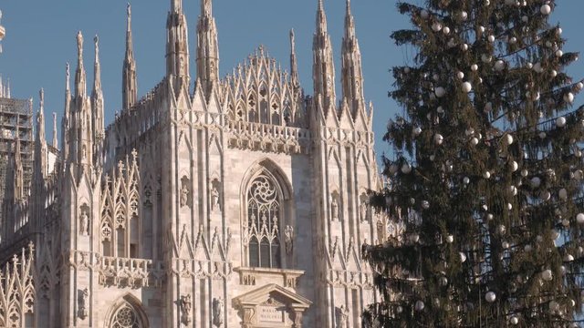 Close up of Christmas tree and Cathedral Duomo in Milan
