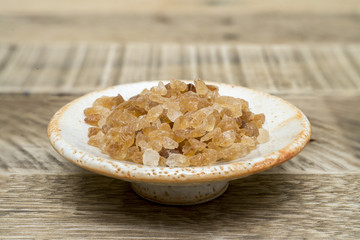Crystalline organic brown rock sugar .