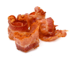 Strips of fried bacon isolated on white