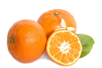 a pair of whole ripe bright orange mandarins with one half