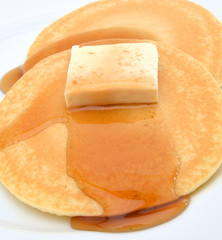 Pancake with honey and cream.