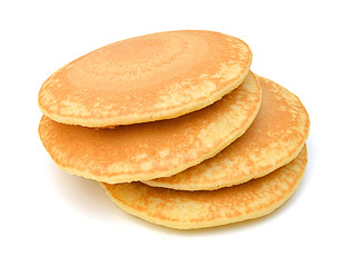 A stack of plain pancakes on a white background.