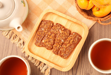 Chocolate crunch  and tea cup served on the table      