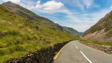 Driving on the road to Llanberis, with Crib Goch on the left, Snowdonia, Gwynedd, Wales, UK