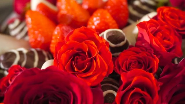 Bouquet with rose and strawberry in chocolate frosting. Rotation movie.