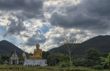 Giant statue of a monk in rural north Thailand near Chiang Rai