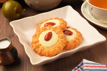 White chocolate almond cookies on a plate