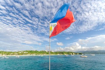 Filipino flag flying in a boat, Boracay