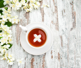 Cup of tea with jasmine flowers