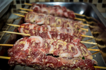 Horizontal View Of Close Up Of Skewers Of Raw Meat