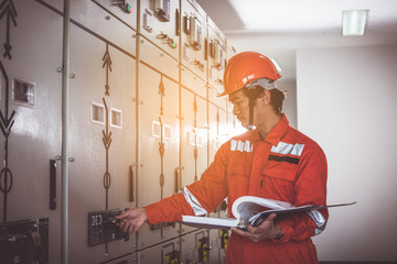 engineering team working on checking and maintenance equipment at green energy solar power plant,...