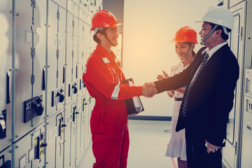 engineering team working on checking and maintenance equipment at green energy solar power plant,...