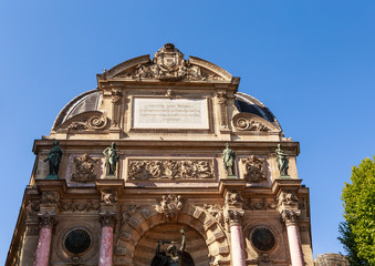 Fototapeta na wymiar Fragment of a fountain Saint-Michel (architect Gabriel Davioud, 1858 - 1860), Paris, France. Popular architectural historical landmark.