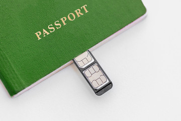 Green Passport with sim cards on a white background, close-up