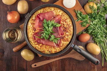 Spanish tortilla with wine, ingredients, and copy space