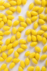   Colorful background of assorted Gumballs isolated over white background