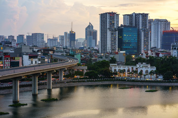 Naklejka premium Aerial skyline view of Hanoi. Hanoi cityscape at twilight at Hoang Cau lake