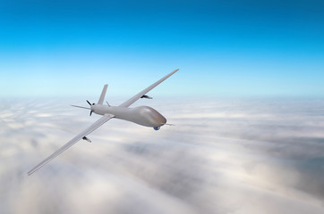 Unmanned military aircraft fly high speed background blue sky clouds.