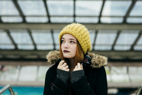Young pretty woman standing in mall