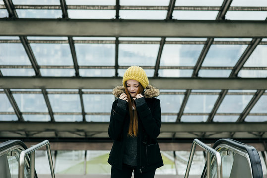 Young pretty woman standing in mall