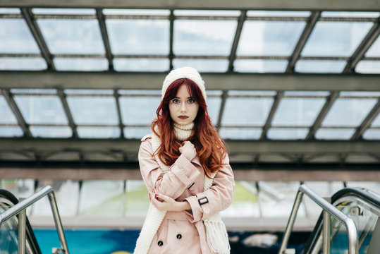 Portrait of young woman standing in mall