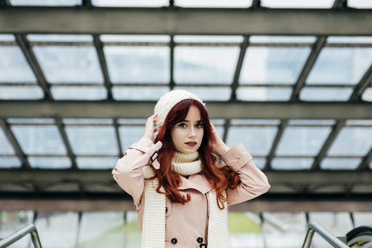 Young pretty woman standing in mall