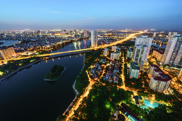 Fototapeta na wymiar Aerial skyline view of Hanoi cityscape at twilight. Linh Dam peninsula, Hoang Mai district, Hanoi, Vietnam