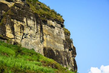 Fototapeta na wymiar Rock mountain cliff and blue sky