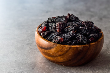 Organic Dried Raw Raisins in Wooden Bowl.