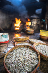 Shrimp in basket before boiling on fire. Seafood processing at fish market in Quy Nhon, south Vietnam