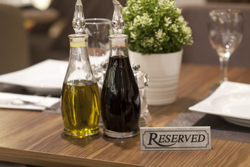 reservation on a dinner table at the restaurant - obrazy, fototapety, plakaty