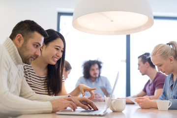 Startup Business Team At A Meeting at modern office building