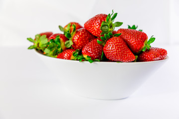 strawberry on white bowl with white background