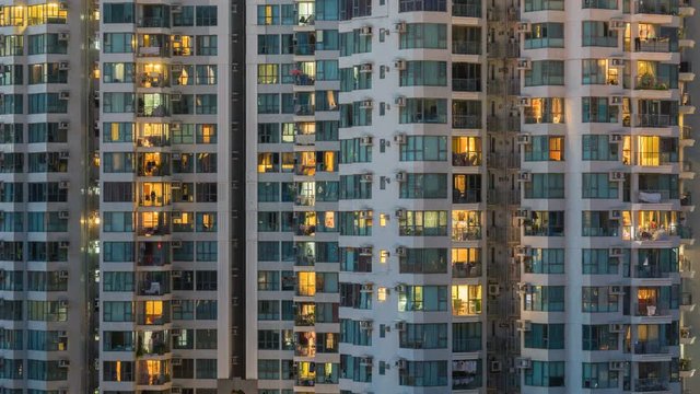 4k timelapse video of residential apartment buildings from day to night