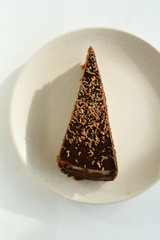 Chocolate cake on white plate