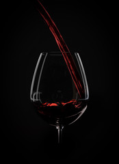 Wine splashes on black background