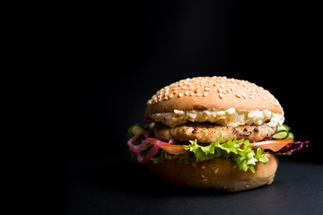 Burger with leaves of lettuce and meat