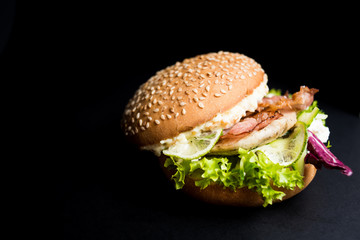 Burger with leaves of lettuce and meat