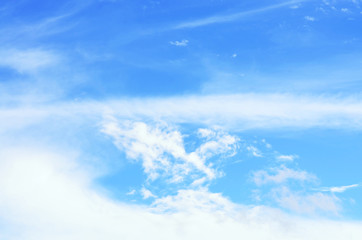 Naklejka na ściany i meble Nature background. White clouds over blue sky.