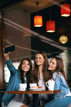 Friends Having Fun, Taking Photos In Cafe.